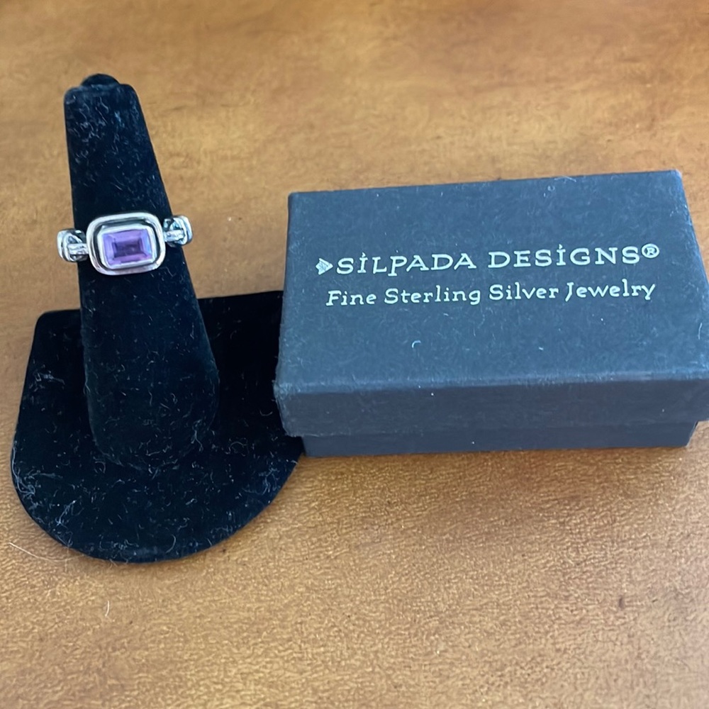Sterling Silver and faceted Amethyst ring. Very good condition.